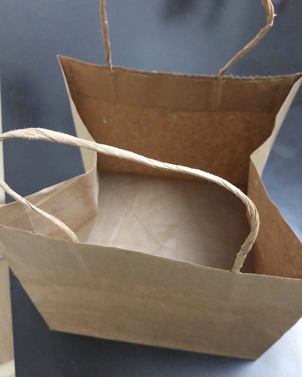 Kraft paper bag shown open from the top